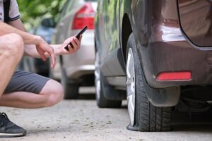 man-taking-photo-of-truck-accident-damage