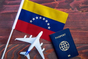 Flag of Venezuela with passport. DHS terminated the 2023 TPS designation for Venezuela.